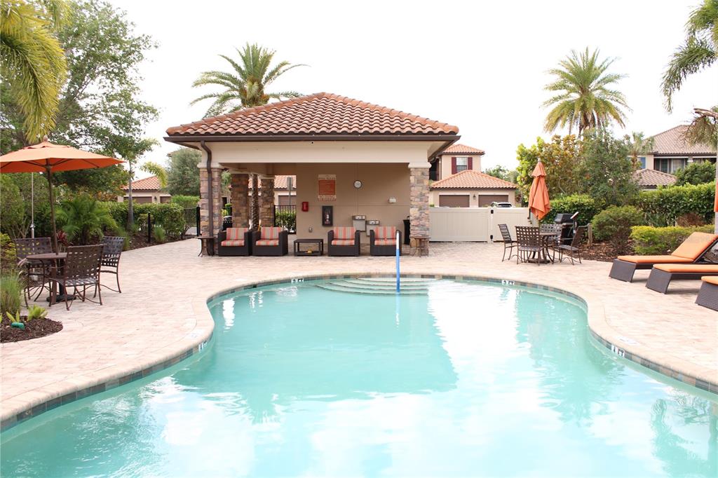 13711 Messina Loop, Unit 104 Bradenton, FL 34211 - Photo 50 of 70 a view of a house with swimming pool and sitting area