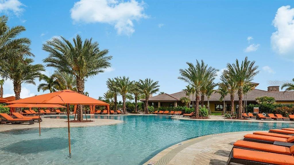 13711 Messina Loop, Unit 104 Bradenton, FL 34211 - Photo 56 of 70 a front view of a house with garden and porch