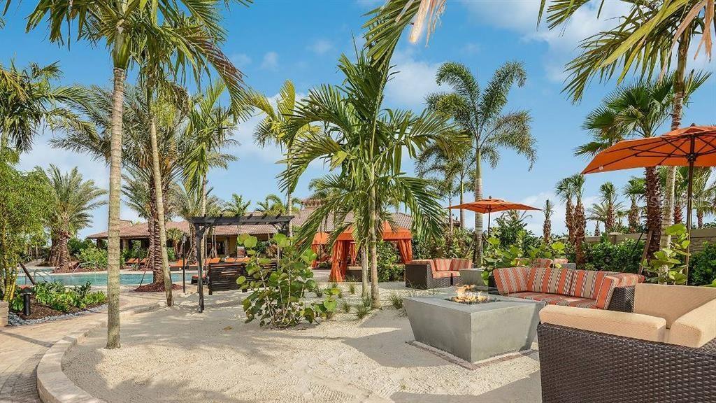 13711 Messina Loop, Unit 104 Bradenton, FL 34211 - Photo 57 of 70 a view of a patio with couches and a fire pit