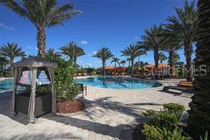 13711 Messina Loop, Unit 104 Bradenton, FL 34211 - Photo 61 of 70 a view of backyard with outdoor seating and lake view