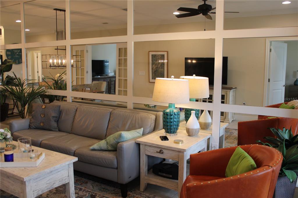 13711 Messina Loop, Unit 104 Bradenton, FL 34211 - Photo 10 of 70 a living room with furniture and view of kitchen