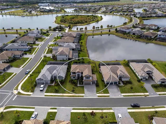 a front view of a house with a garden and plants