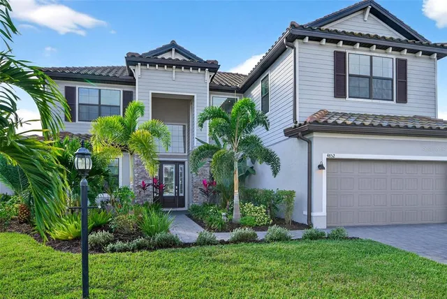 a view of a room with wooden floor and windows
