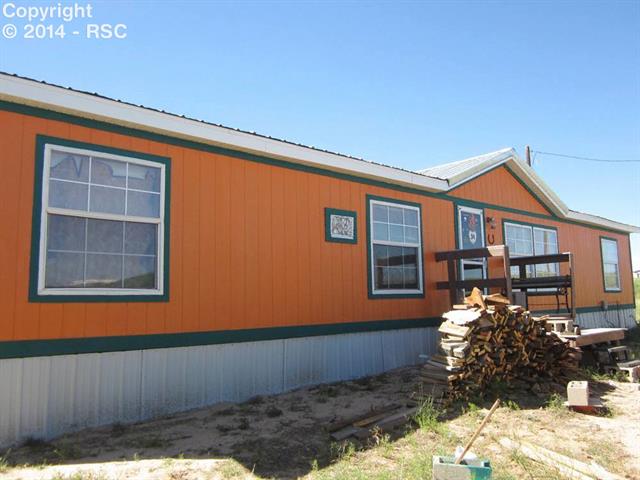 15640 South Lauppe Road Yoder, CO 80864 - Photo 2 of 12 Looking at the front of this home from the opposite direction.