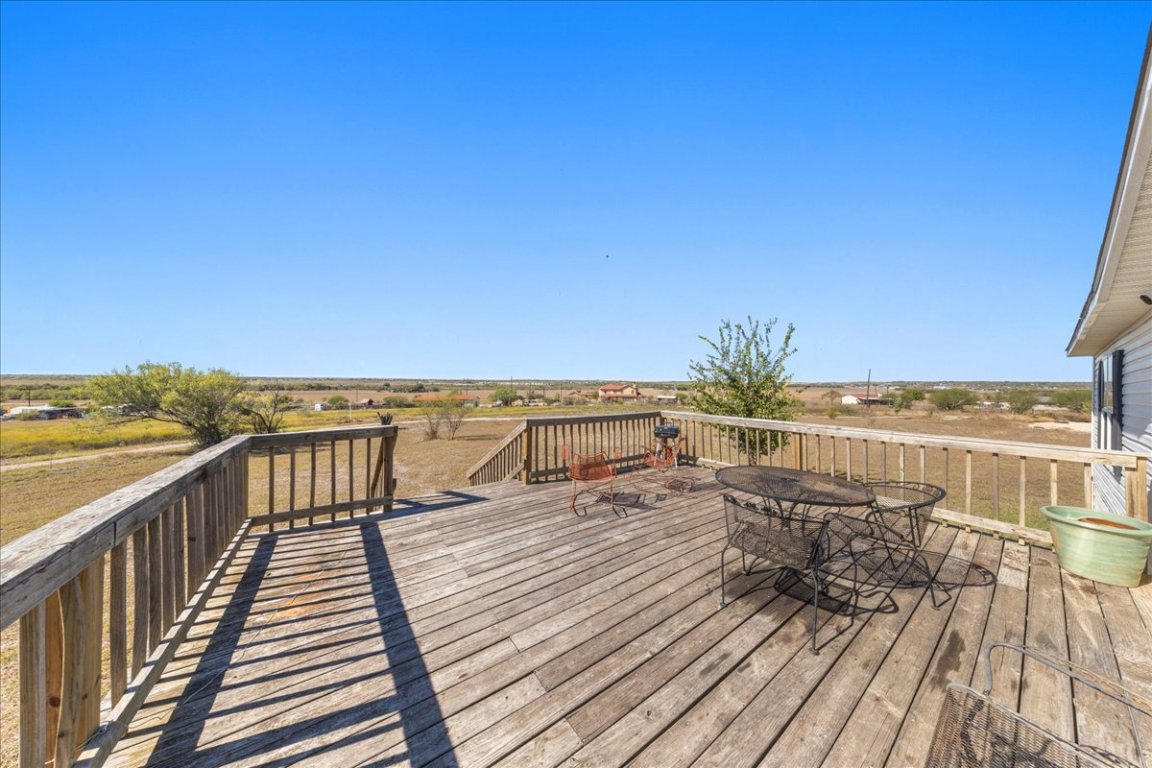 1307 Graef Road, Unit B Kyle, TX 78640 - Photo 12 of 40 a view of balcony with wooden floor and seating space