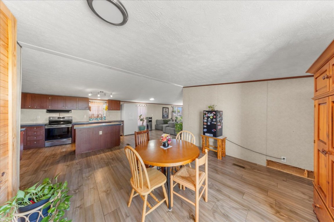 1307 Graef Road, Unit B Kyle, TX 78640 - Photo 15 of 40 a view of a dining room kitchen and a wooden floor