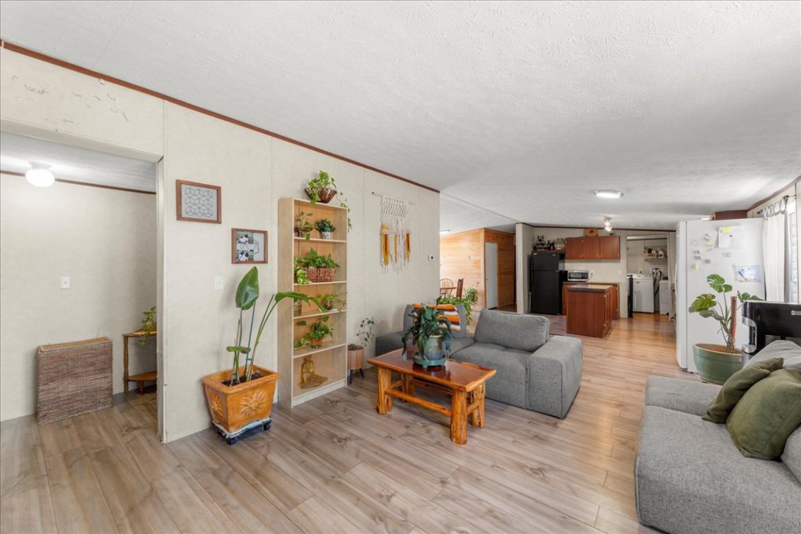 1307 Graef Road, Unit B Kyle, TX 78640 - Photo 26 of 40 a living room with furniture and wooden floor