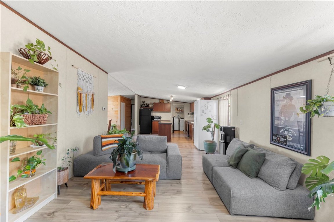 1307 Graef Road, Unit B Kyle, TX 78640 - Photo 27 of 40 a living room with furniture and wooden floor