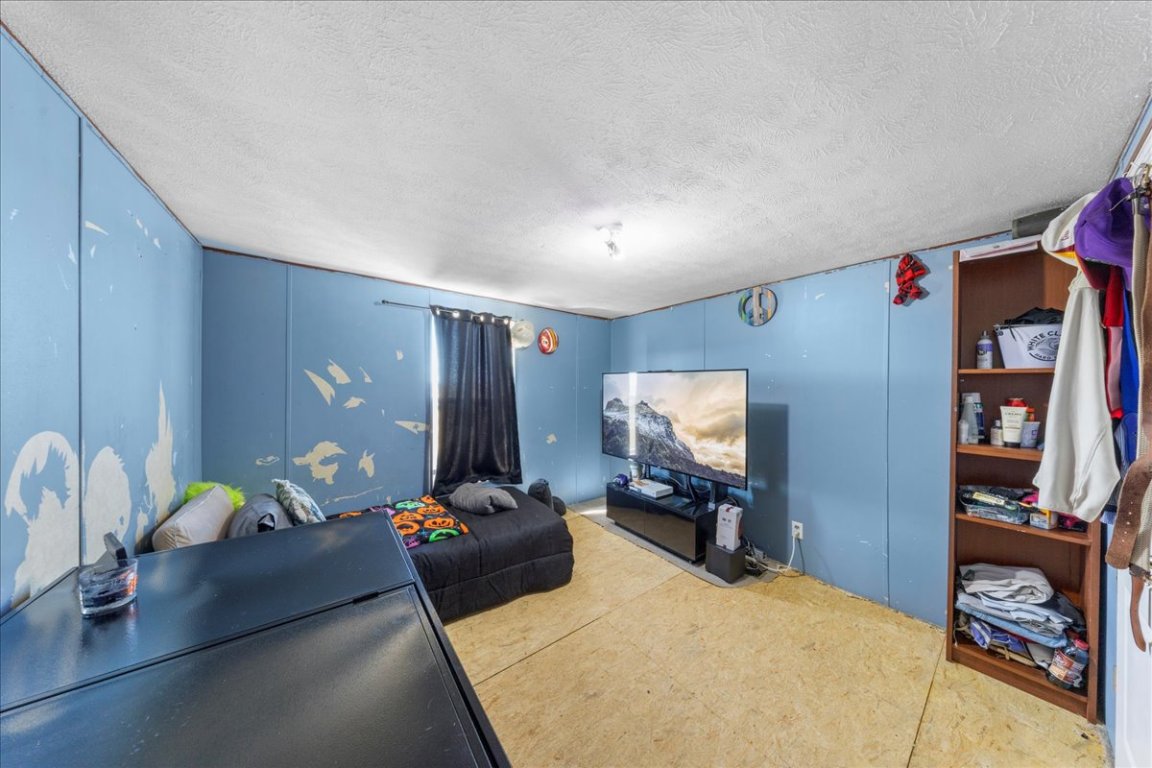 1307 Graef Road, Unit B Kyle, TX 78640 - Photo 28 of 40 a living room with furniture and a flat screen tv