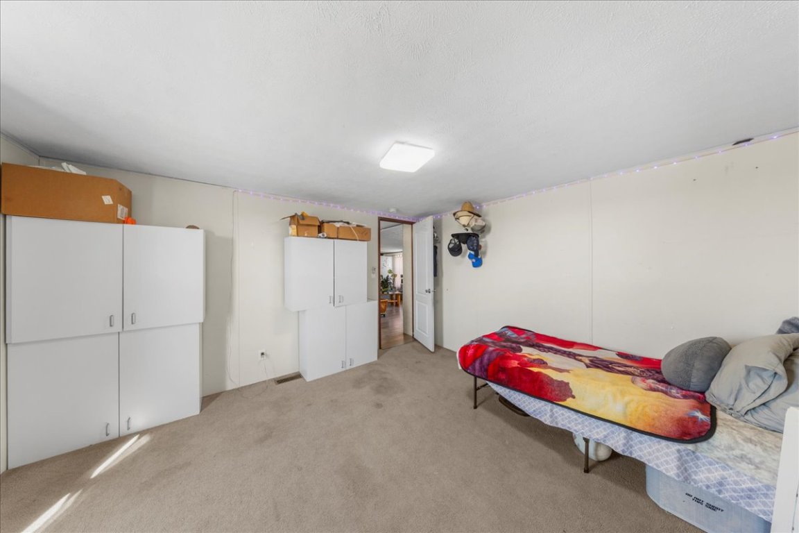 1307 Graef Road, Unit B Kyle, TX 78640 - Photo 32 of 40 a hallway with toys and dresser