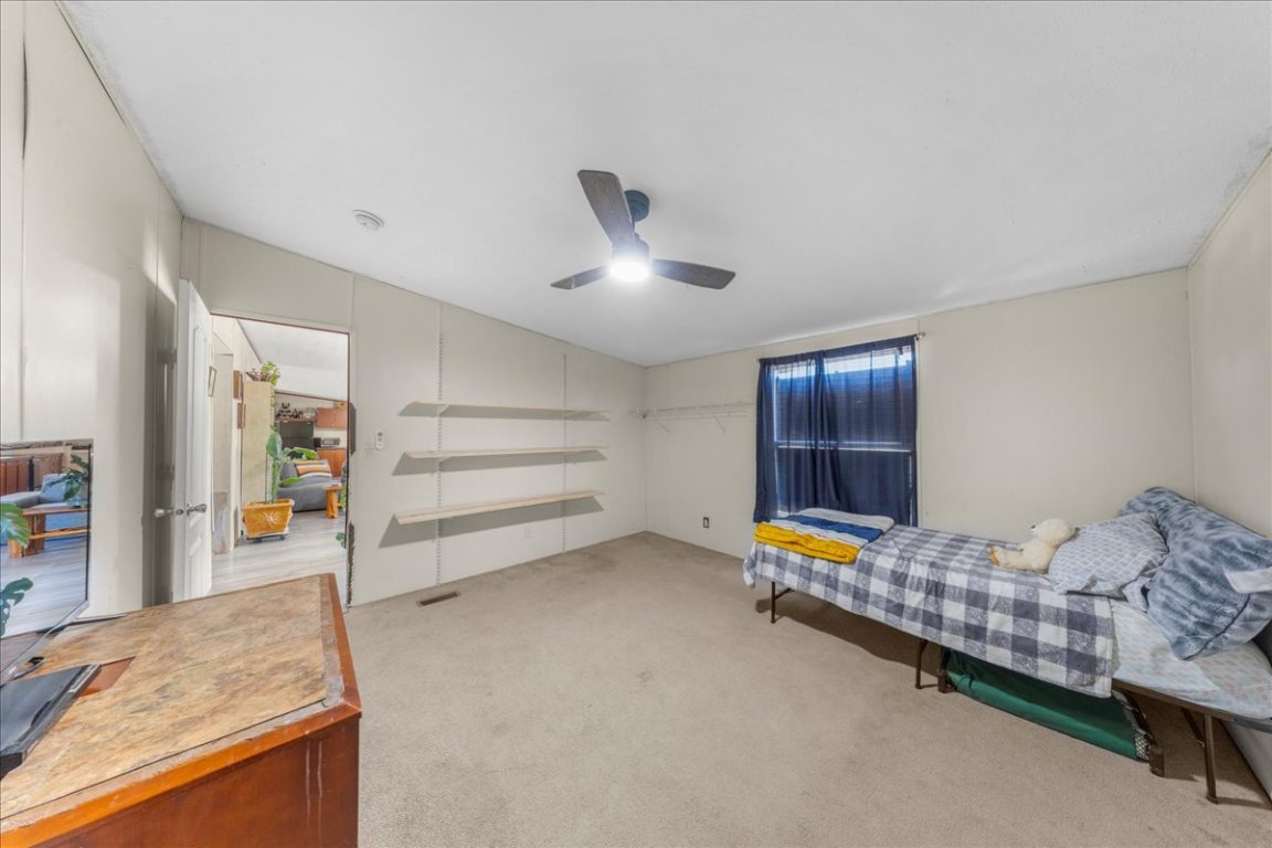 1307 Graef Road, Unit B Kyle, TX 78640 - Photo 34 of 40 a bedroom with bed and window