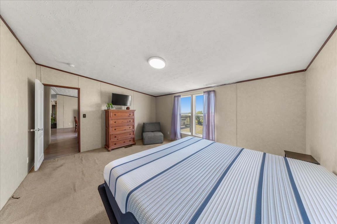 1307 Graef Road, Unit B Kyle, TX 78640 - Photo 36 of 40 a bedroom with a bed and closet