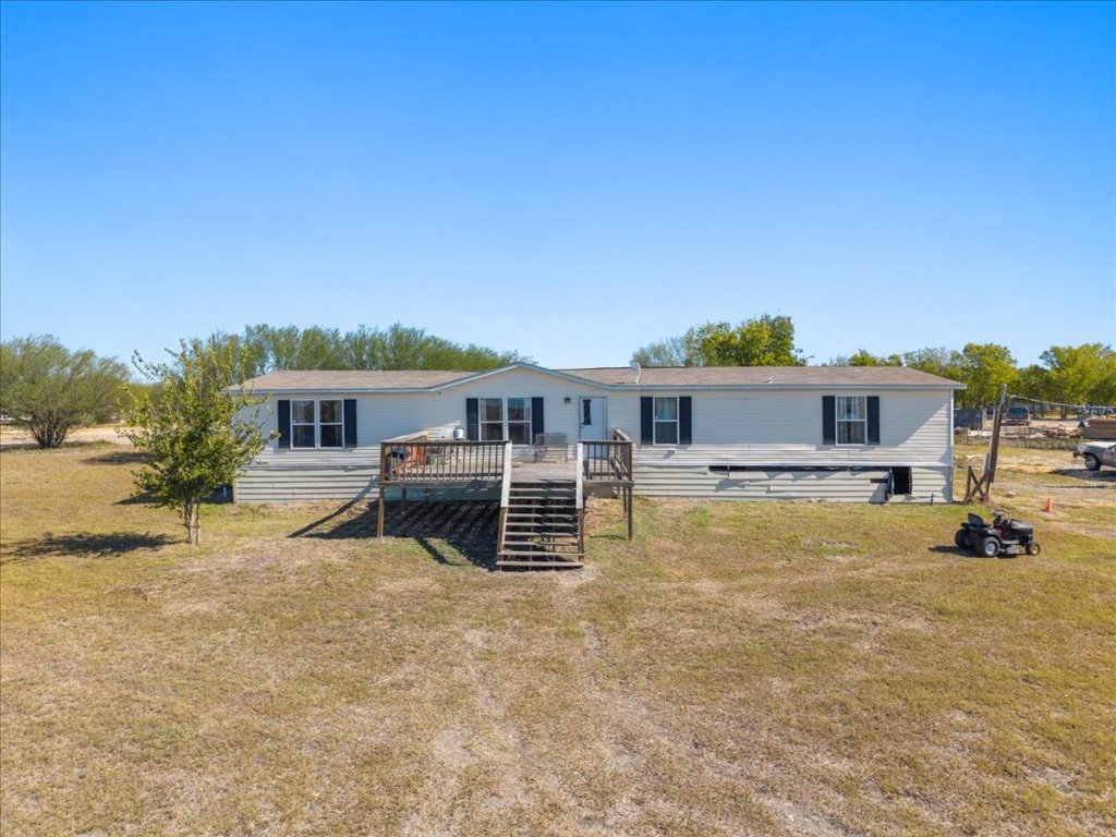 1307 Graef Road, Unit B Kyle, TX 78640 - Photo 4 of 40 a front view of a house with a yard