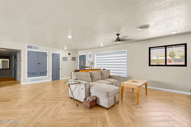 a living room with furniture and a window