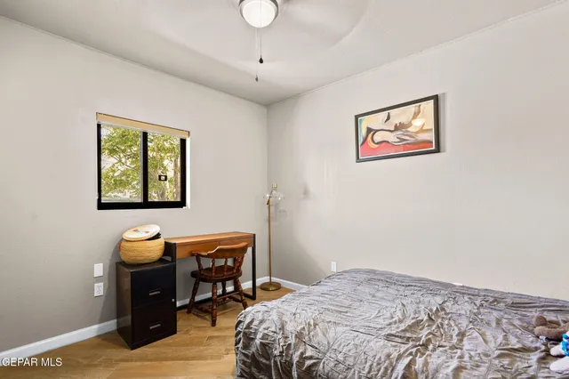 a bedroom with a bed and a dresser