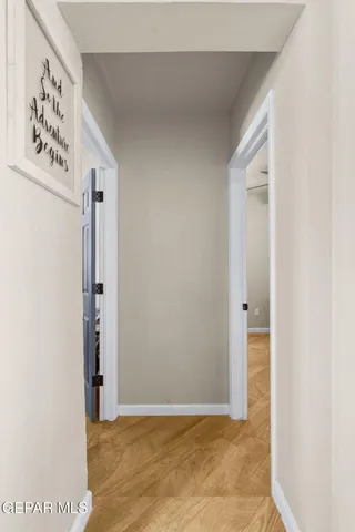 a room with a wooden floor and shoes