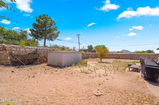 a view of a house with snow in the background