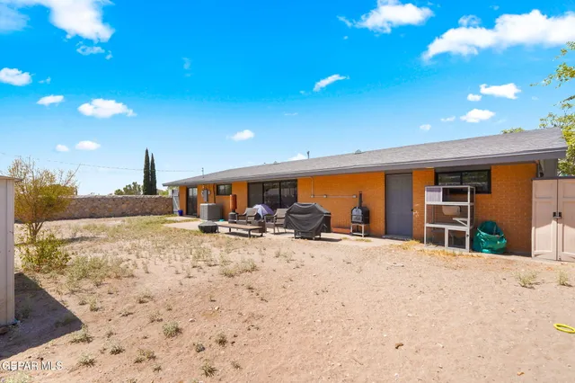 a view of a house with a snow in the yard