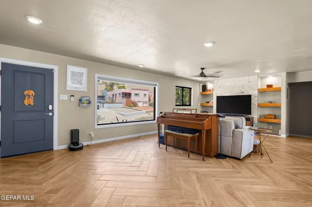 a living room with furniture and a flat screen tv