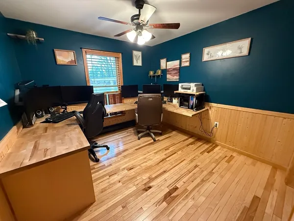 a room with furniture pool table and windows