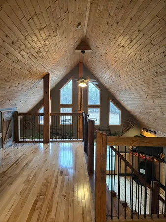 a view of a hall with wooden floor