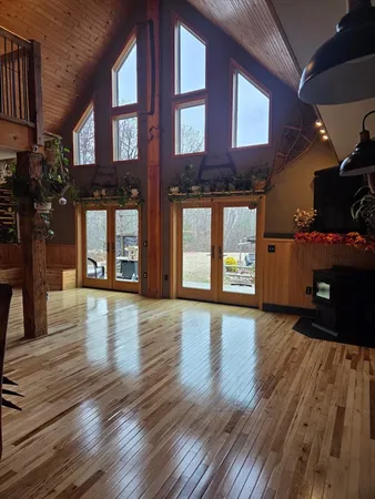 a view of an entryway with wooden floor