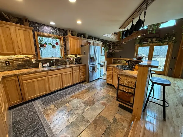 a kitchen with lots of counter top space and appliances