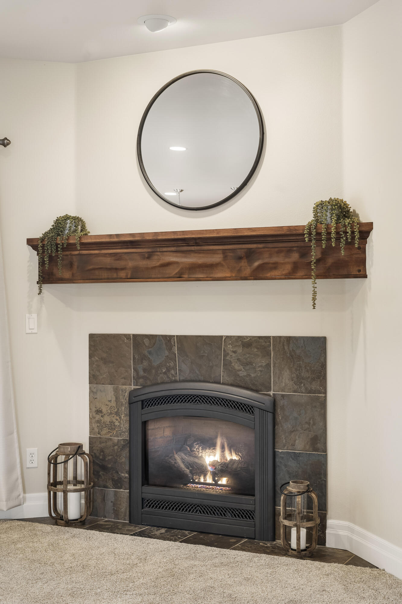 784 Ribbon Falls Road Redmond, OR 97756 - Photo 21 of 79 a front view of a fireplace with a mirror