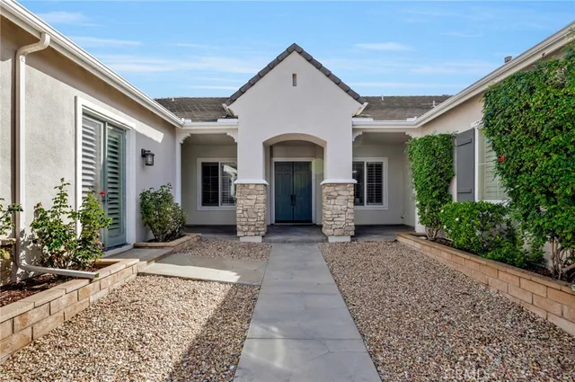 a front view of a house with garden