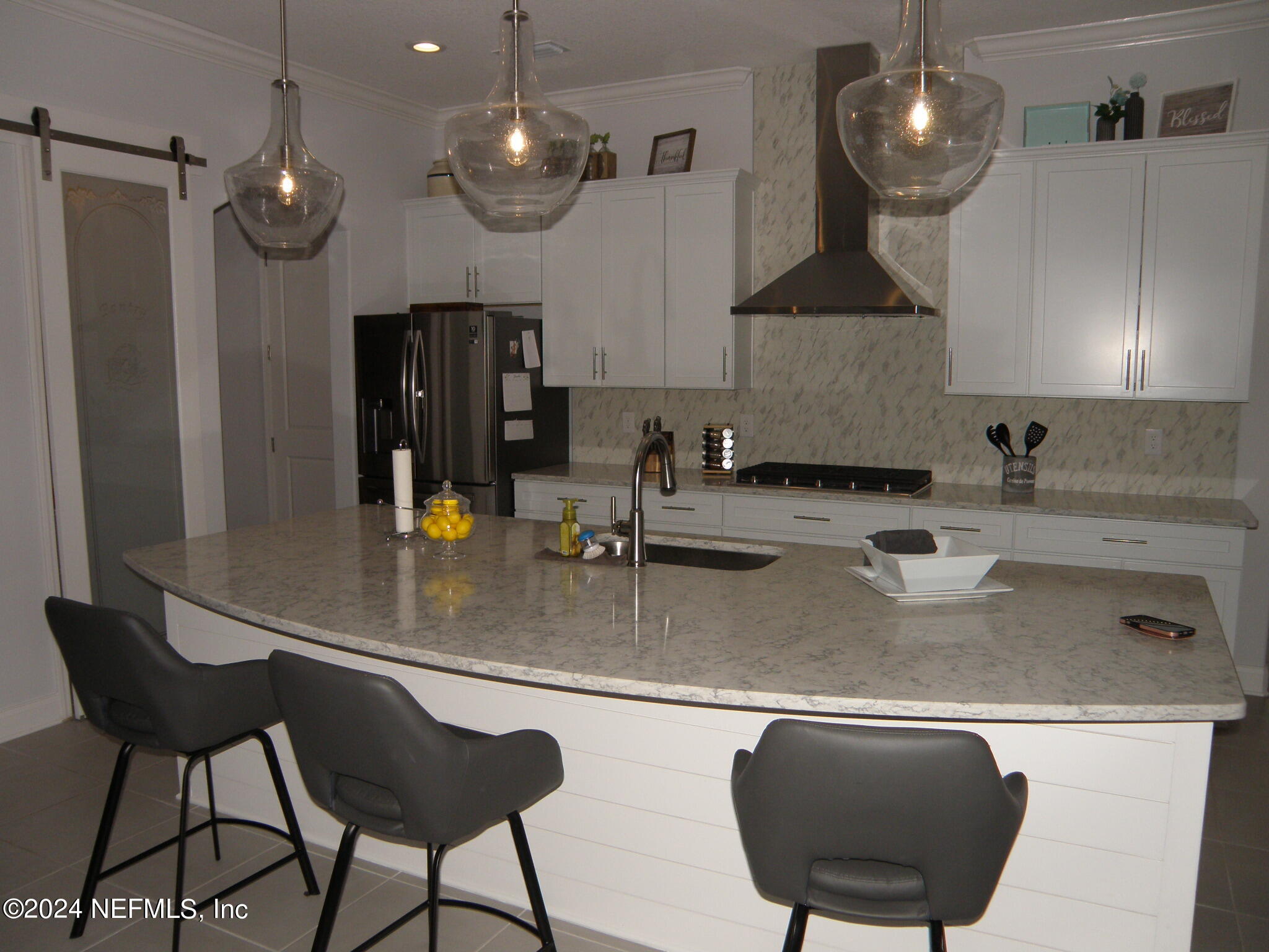 375 Silver Pine Drive St. Augustine, FL 32092 - Photo 14 of 84 a kitchen with stainless steel appliances granite countertop a sink a stove and a refrigerator