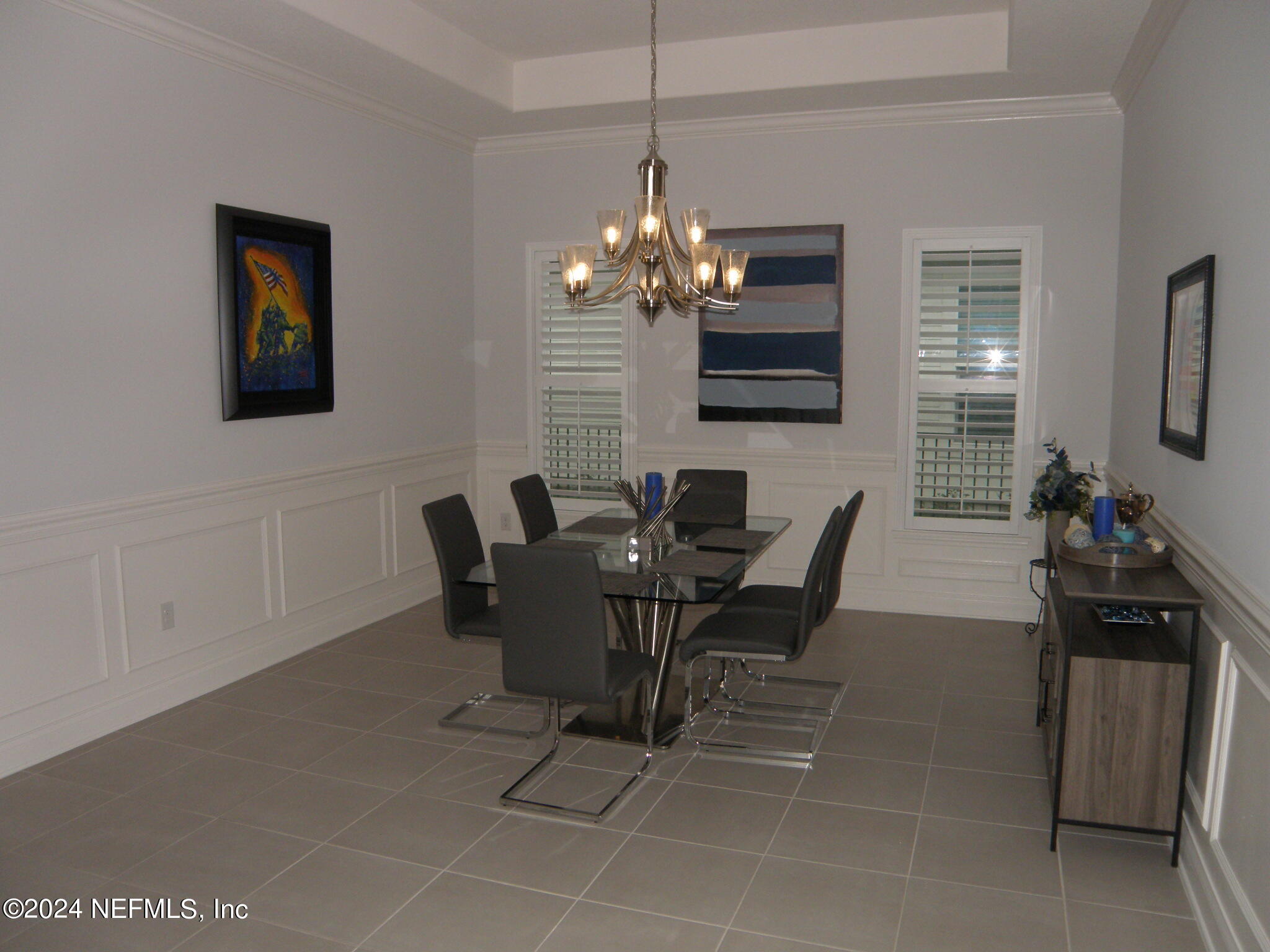 375 Silver Pine Drive St. Augustine, FL 32092 - Photo 16 of 84 a view of a dining room with furniture and chandelier
