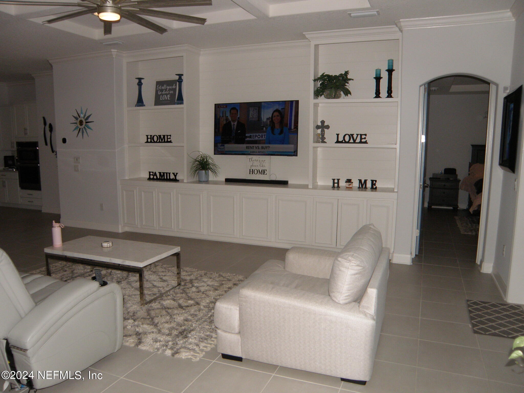 375 Silver Pine Drive St. Augustine, FL 32092 - Photo 18 of 84 a living room with furniture and a flat screen tv