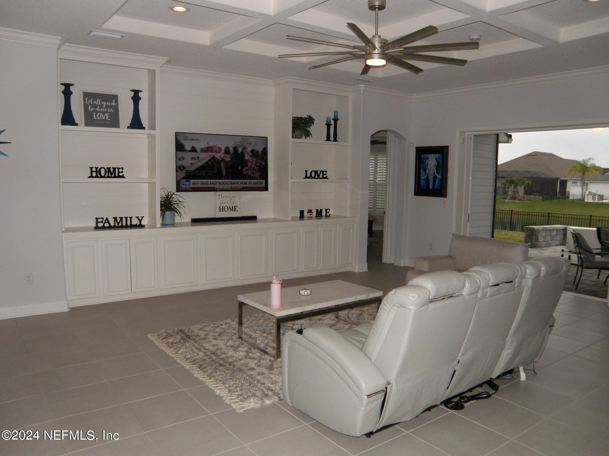 375 Silver Pine Drive St. Augustine, FL 32092 - Photo 19 of 84 a living room with furniture and a flat screen tv