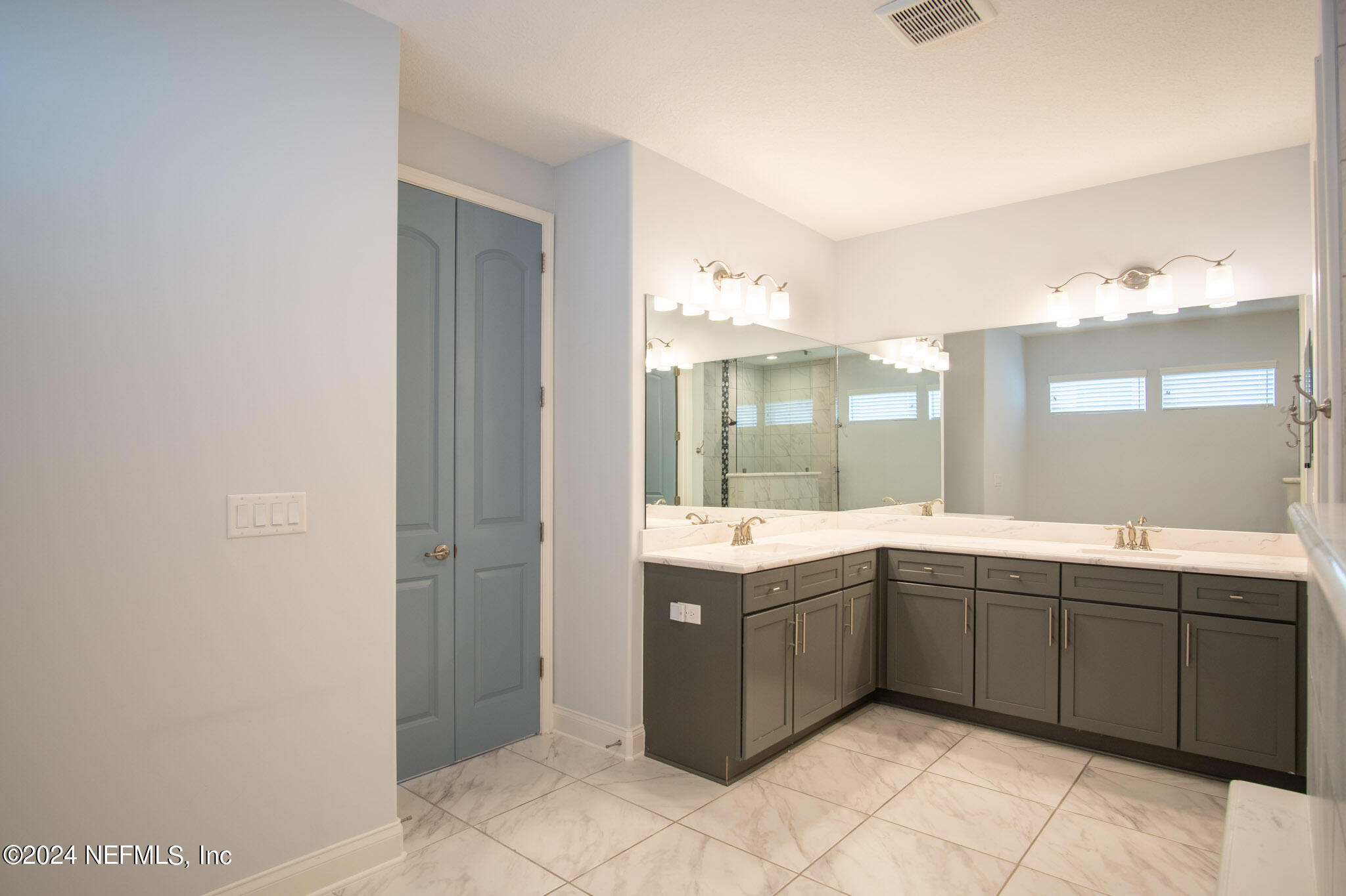 375 Silver Pine Drive St. Augustine, FL 32092 - Photo 31 of 84 a large bathroom with a double vanity sink and mirror