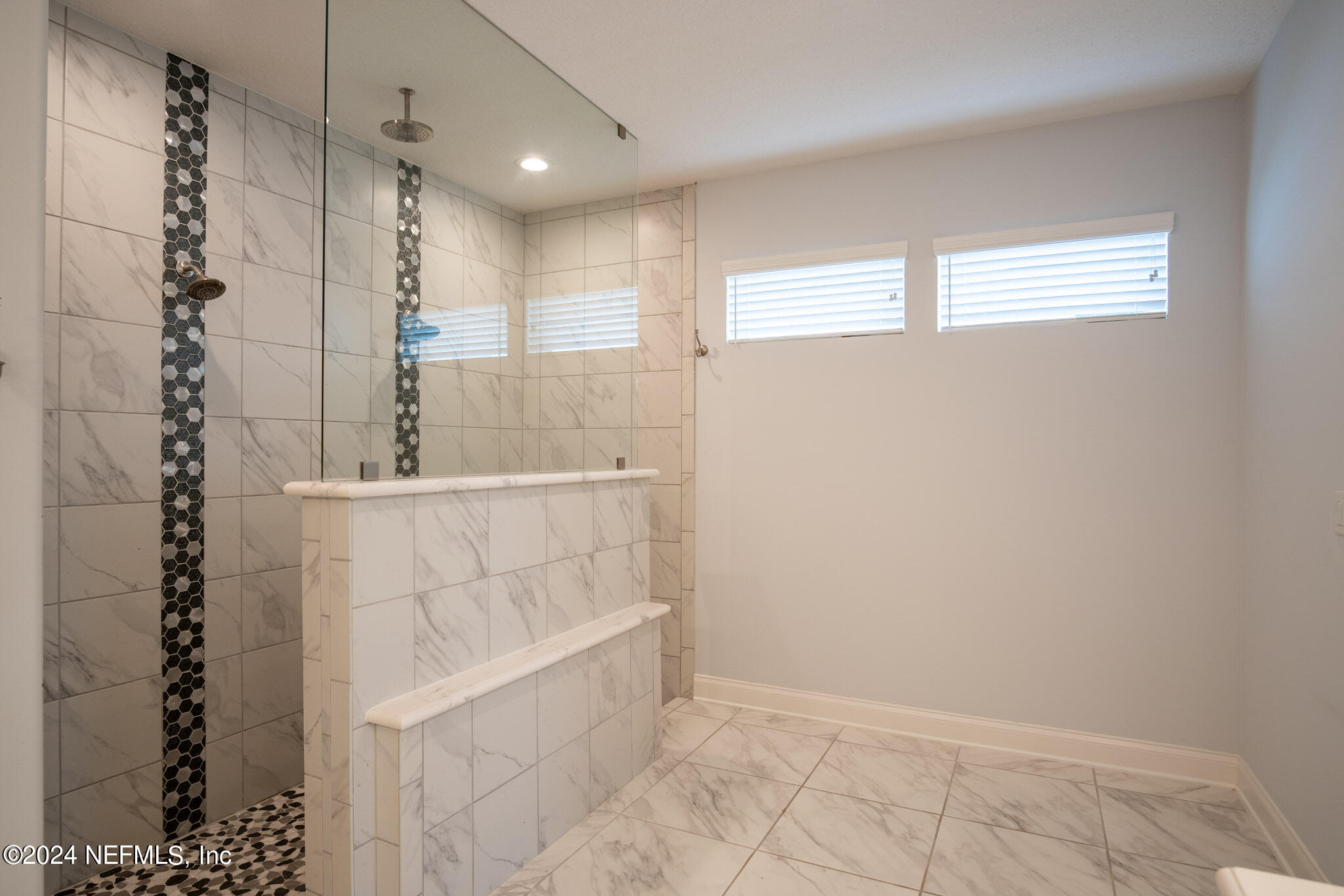 375 Silver Pine Drive St. Augustine, FL 32092 - Photo 33 of 84 a bathroom with a bathtub and shower