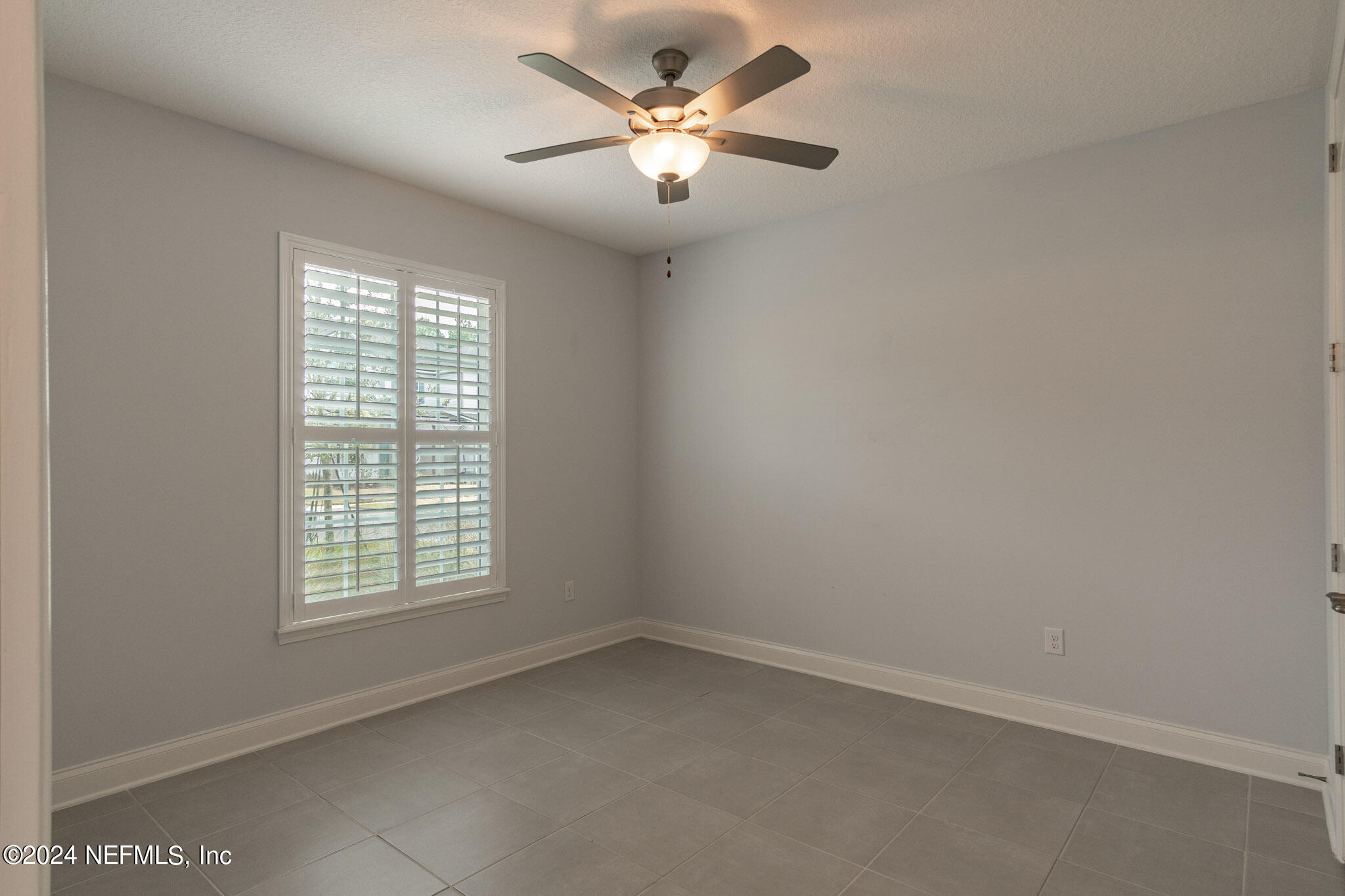 375 Silver Pine Drive St. Augustine, FL 32092 - Photo 36 of 84 an empty room with a window and a fan