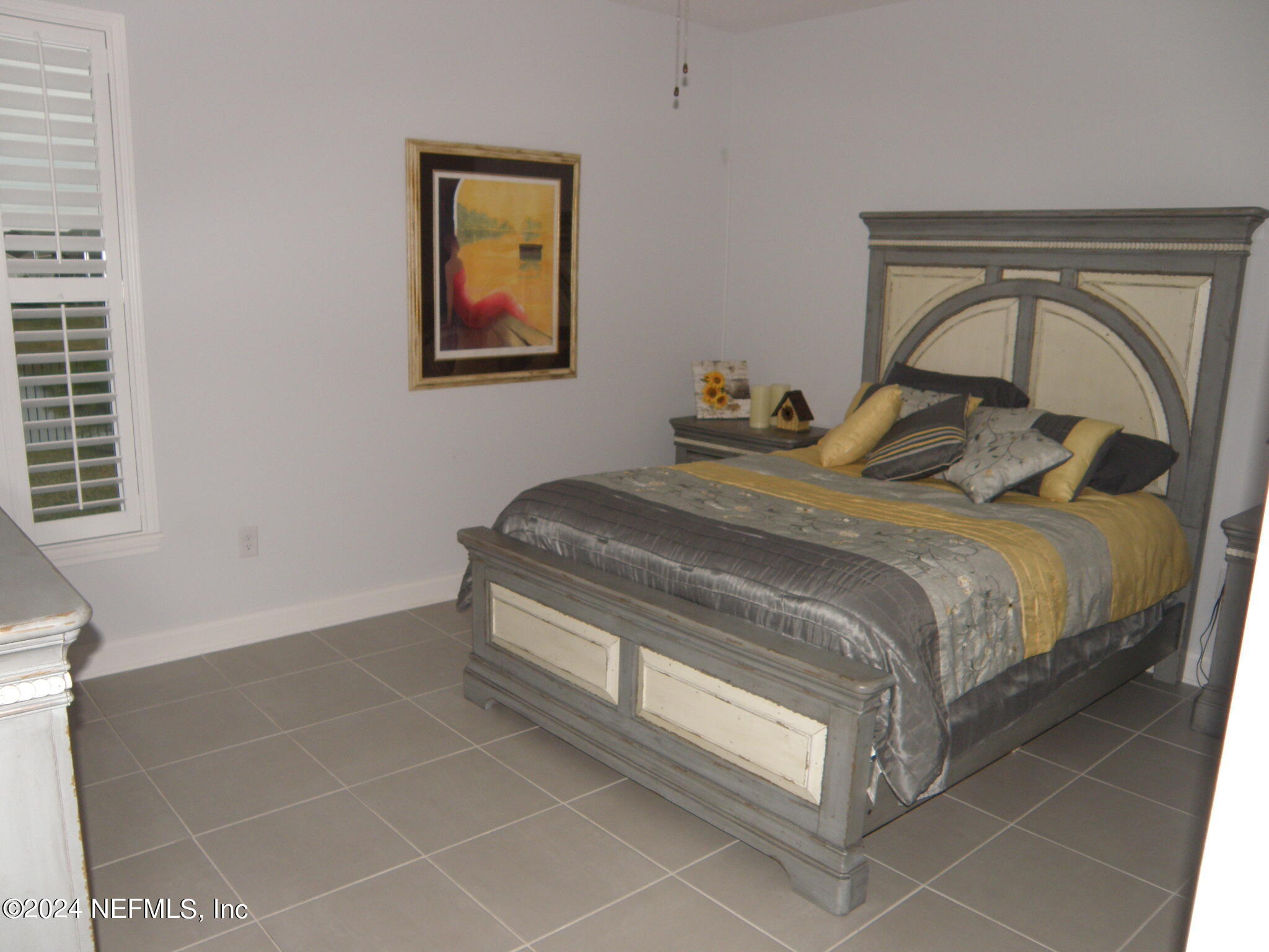 375 Silver Pine Drive St. Augustine, FL 32092 - Photo 37 of 84 a bedroom with a bed and a window