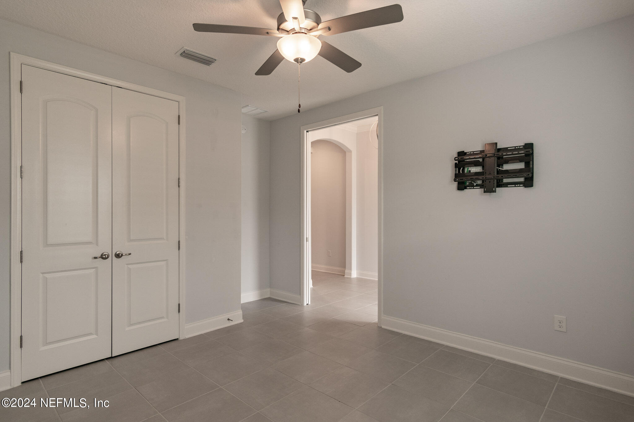 375 Silver Pine Drive St. Augustine, FL 32092 - Photo 38 of 84 an empty room with closet and a chandelier fan