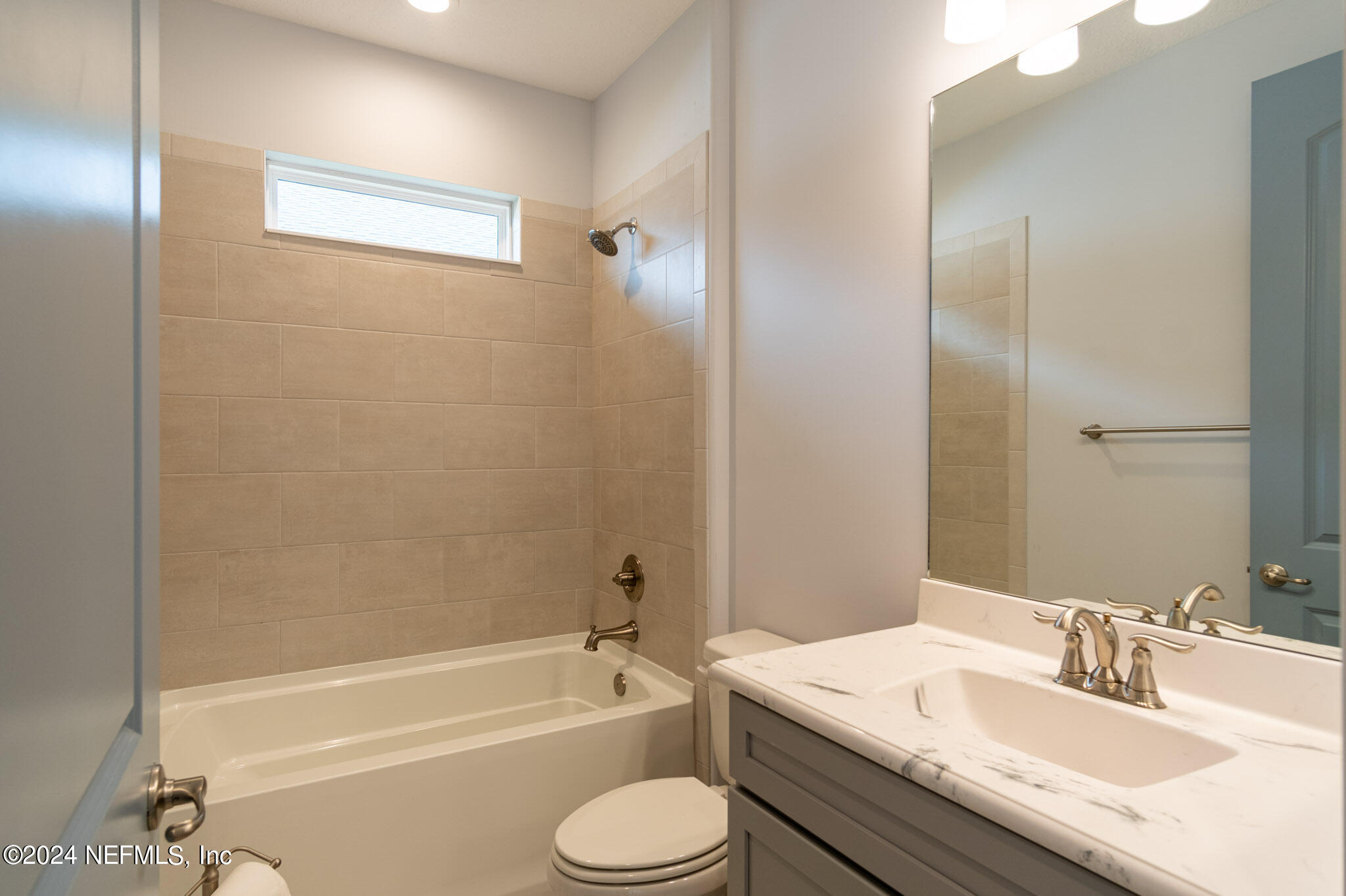 375 Silver Pine Drive St. Augustine, FL 32092 - Photo 40 of 84 a bathroom with a granite countertop sink toilet tub and shower