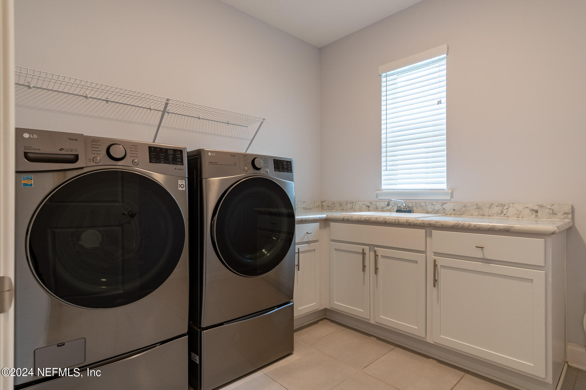 375 Silver Pine Drive St. Augustine, FL 32092 - Photo 43 of 84 a utility room with sink dryer and washer