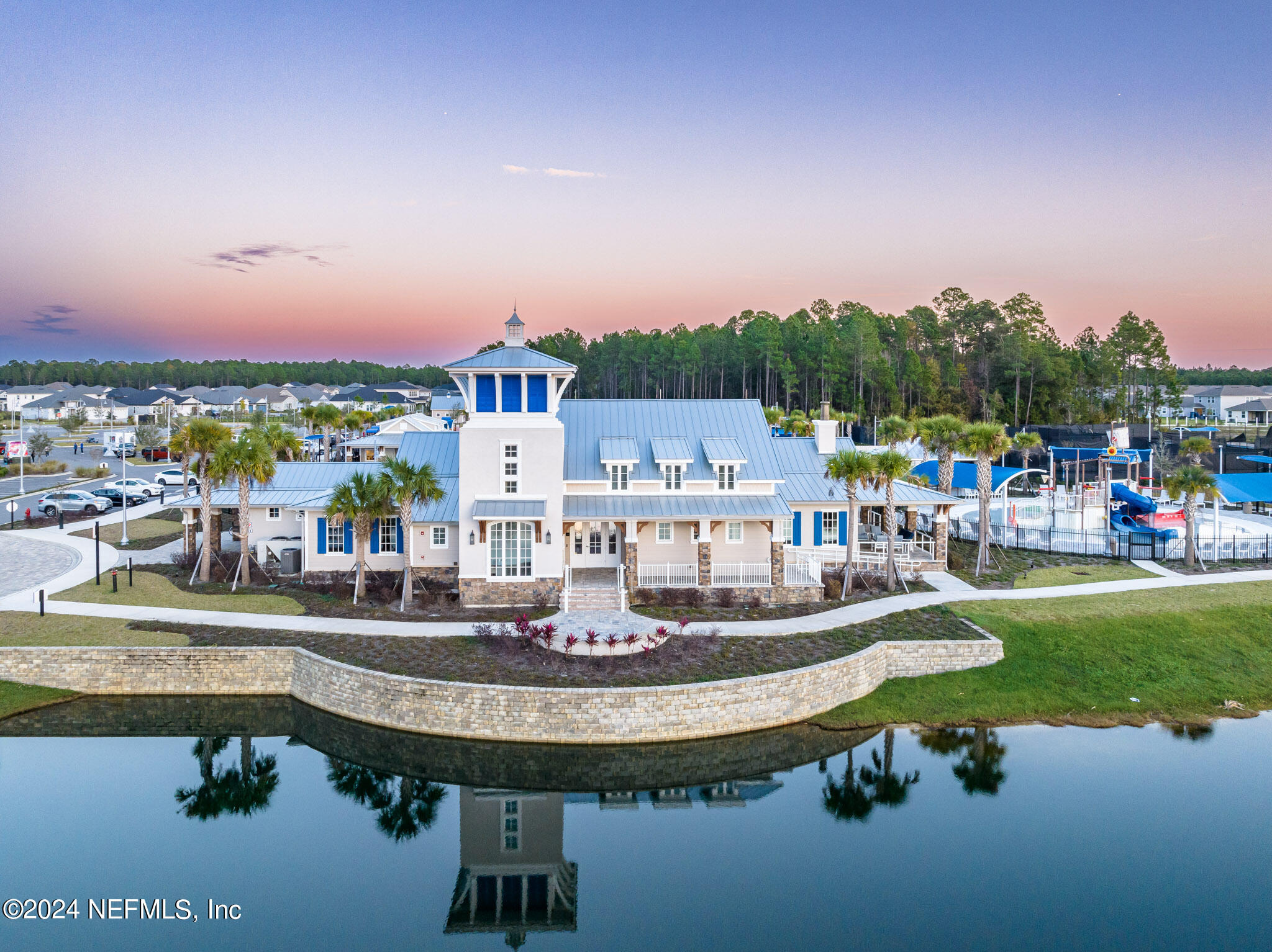 375 Silver Pine Drive St. Augustine, FL 32092 - Photo 50 of 84 a view of a lake with a house swimming pool and a yard