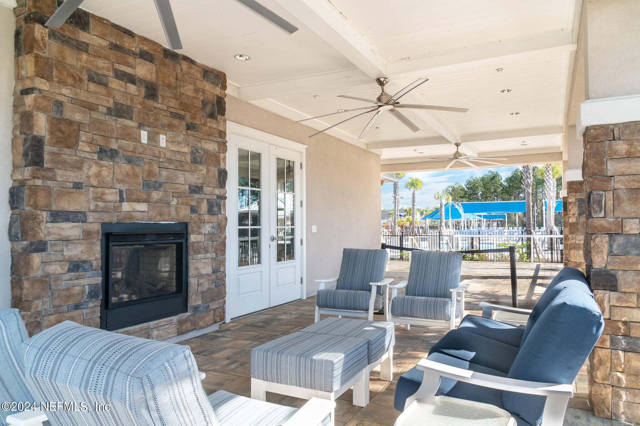375 Silver Pine Drive St. Augustine, FL 32092 - Photo 78 of 84 a living room with furniture and a fireplace