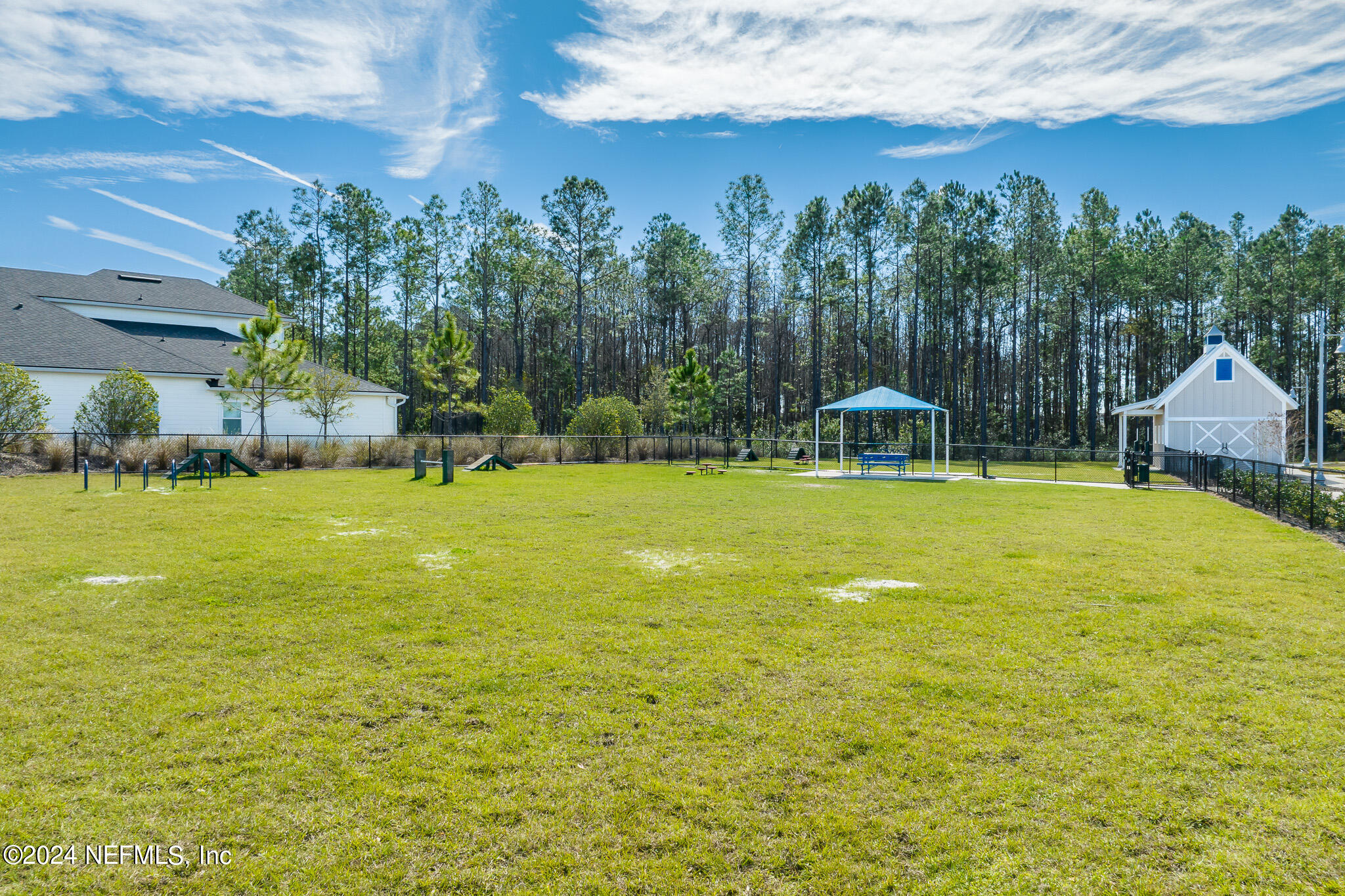 375 Silver Pine Drive St. Augustine, FL 32092 - Photo 81 of 84 a view of a swimming pool with an outdoor seating and a yard