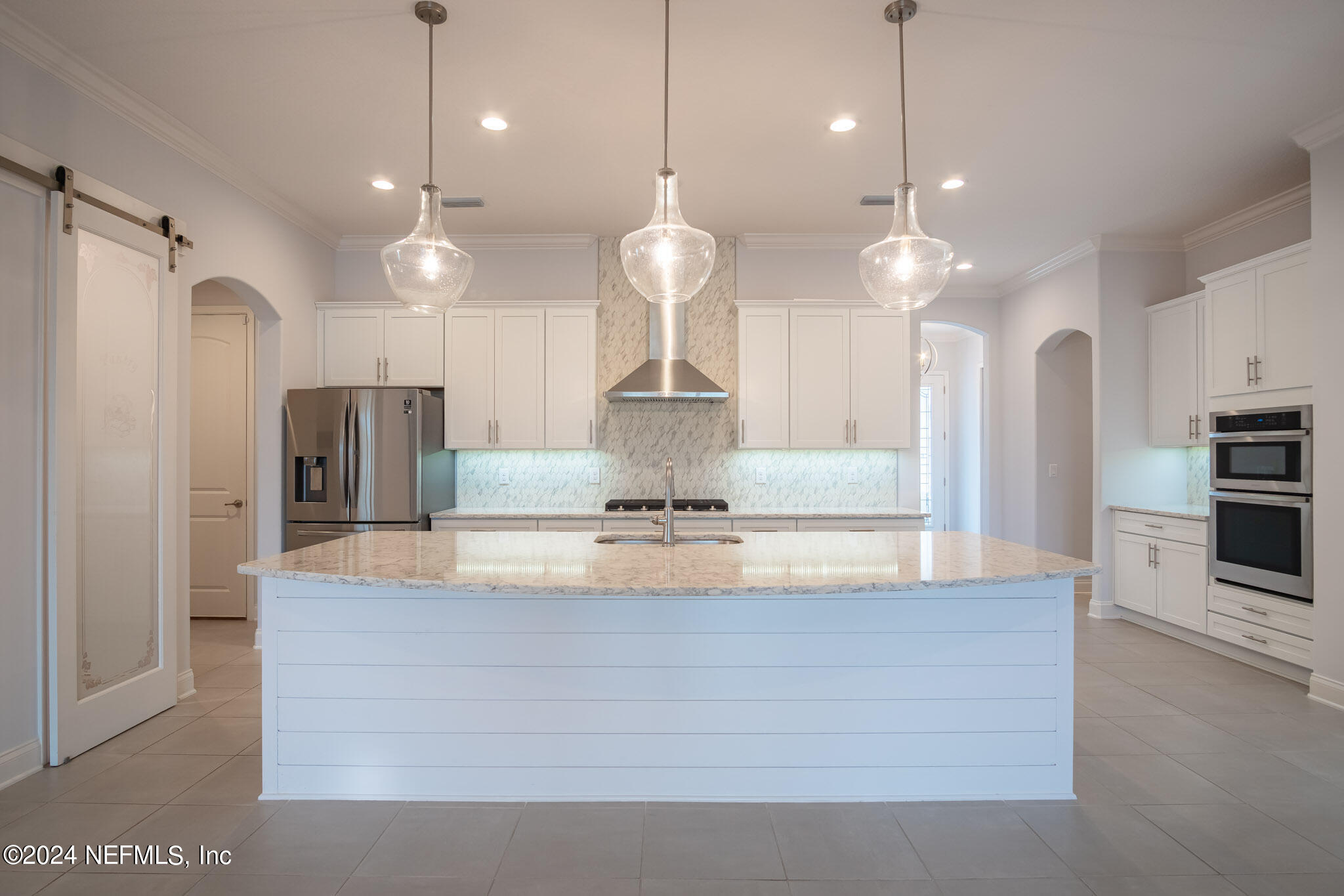 375 Silver Pine Drive St. Augustine, FL 32092 - Photo 9 of 84 a large kitchen with stainless steel appliances kitchen island a refrigerator and a chandelier