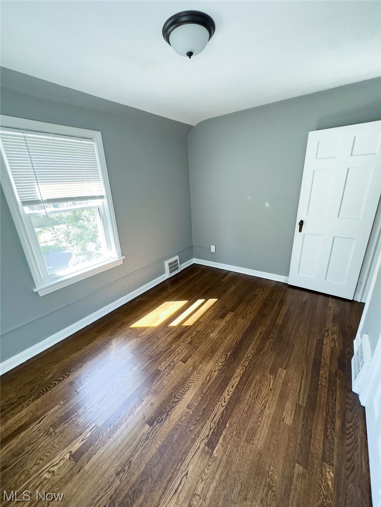 3985 Rosemond Road Cleveland Heights, OH 44121 - Photo 14 of 25 Unfurnished room with dark hardwood flooring