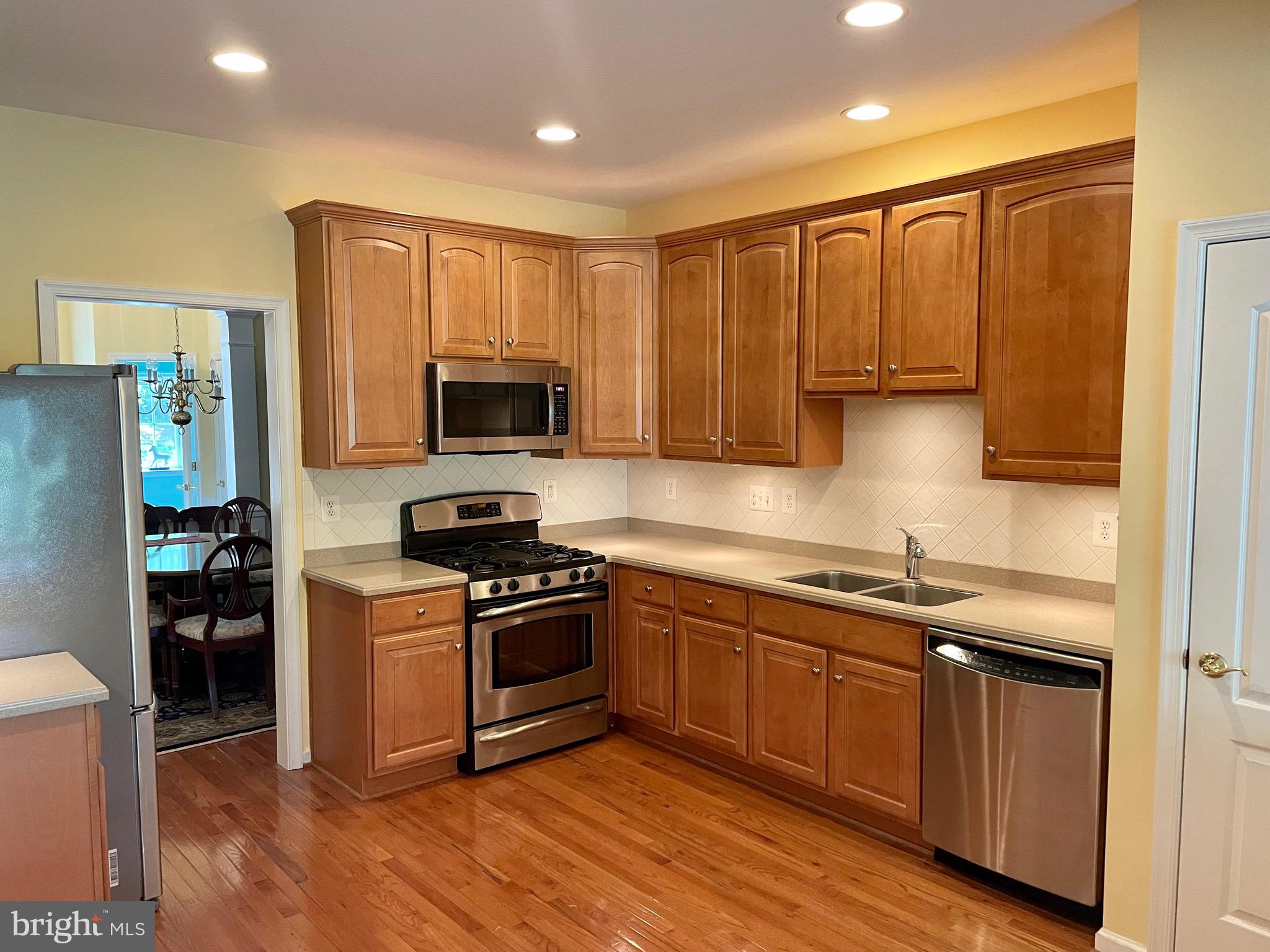 8258 Academy Road, Unit 6 Ellicott City, MD 21043 - Photo 3 of 36 42" Cabinets & Recessed lighting in 9' foot ceilin
