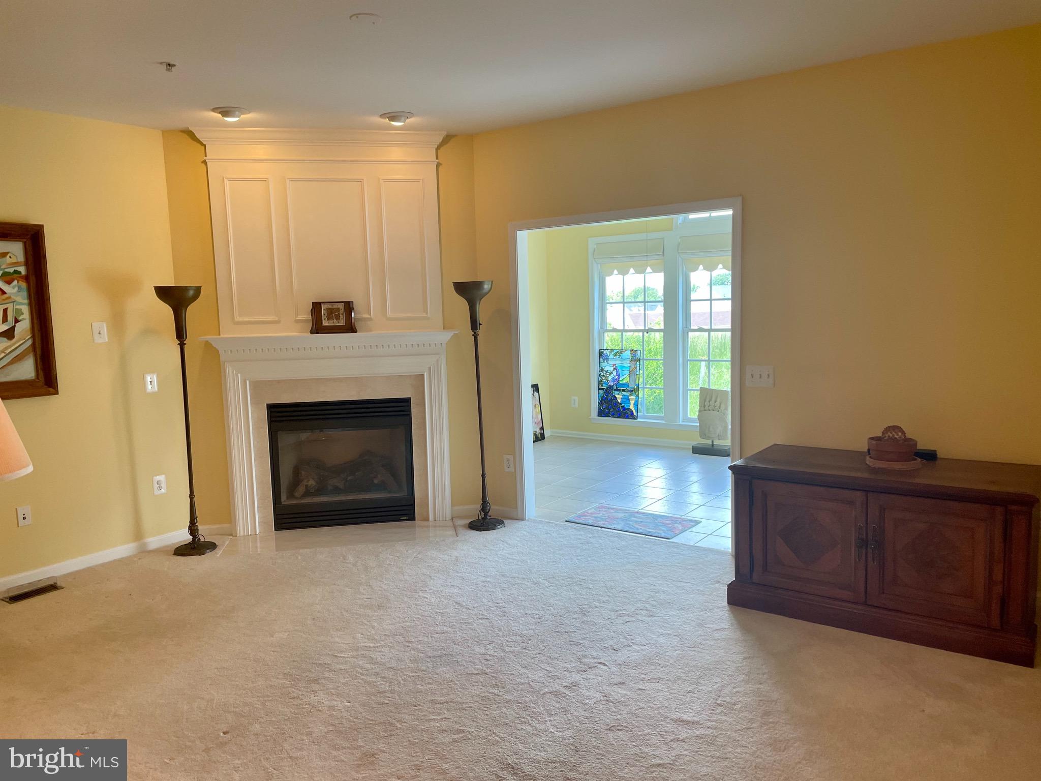 8258 Academy Road, Unit 6 Ellicott City, MD 21043 - Photo 6 of 36 Gas Fireplace in family room off kitchen