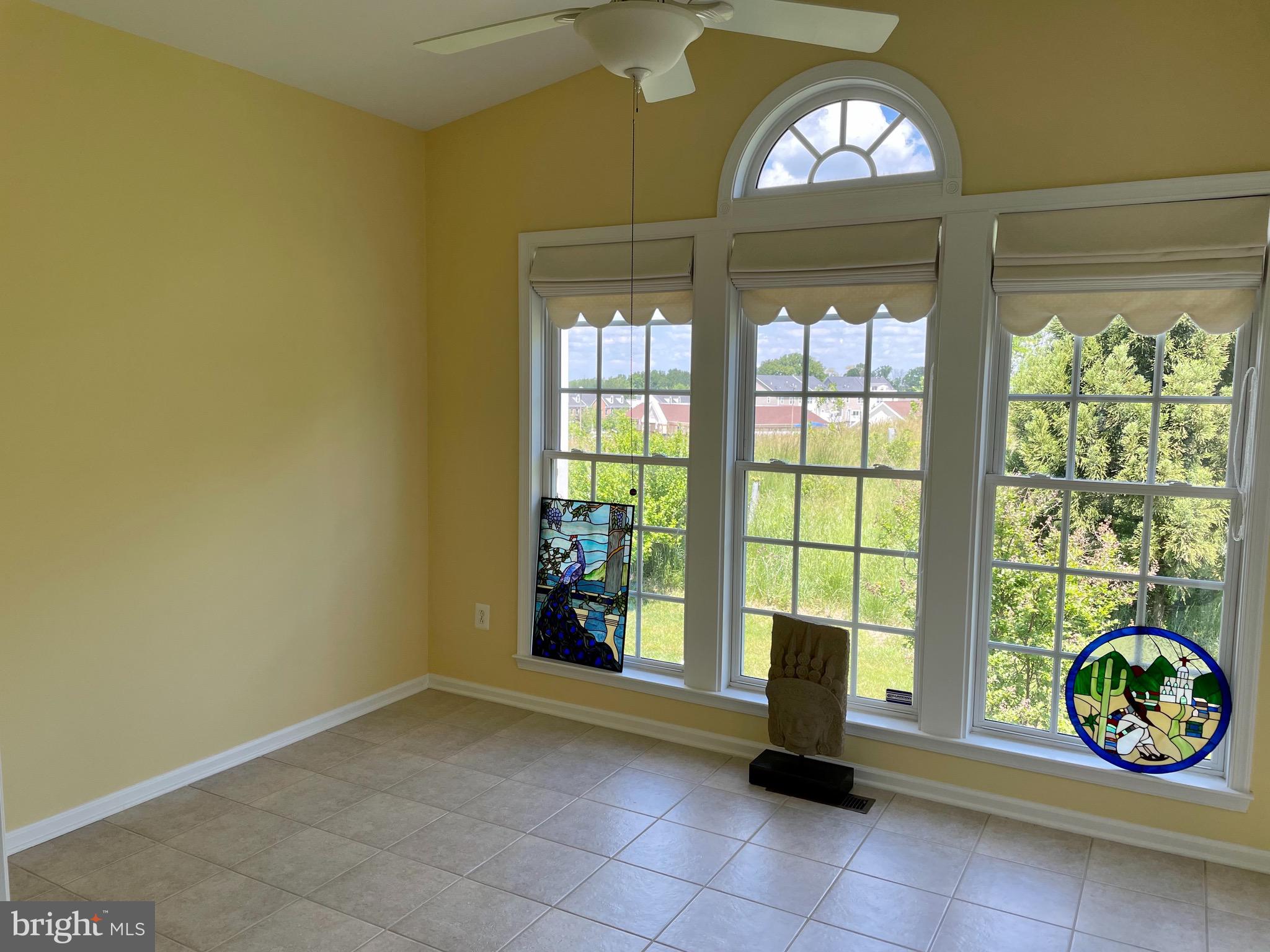 8258 Academy Road, Unit 6 Ellicott City, MD 21043 - Photo 8 of 36 Sunroom with ceiling fan