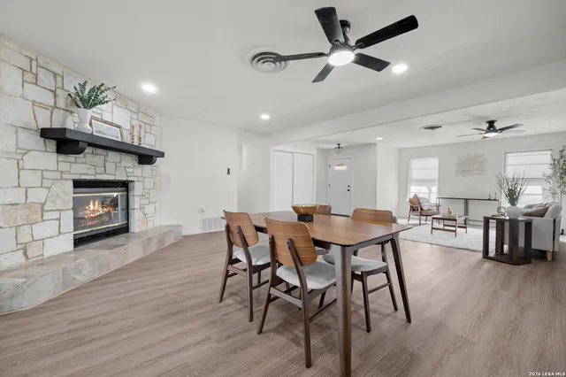 a view of a dining room with furniture and wooden floor