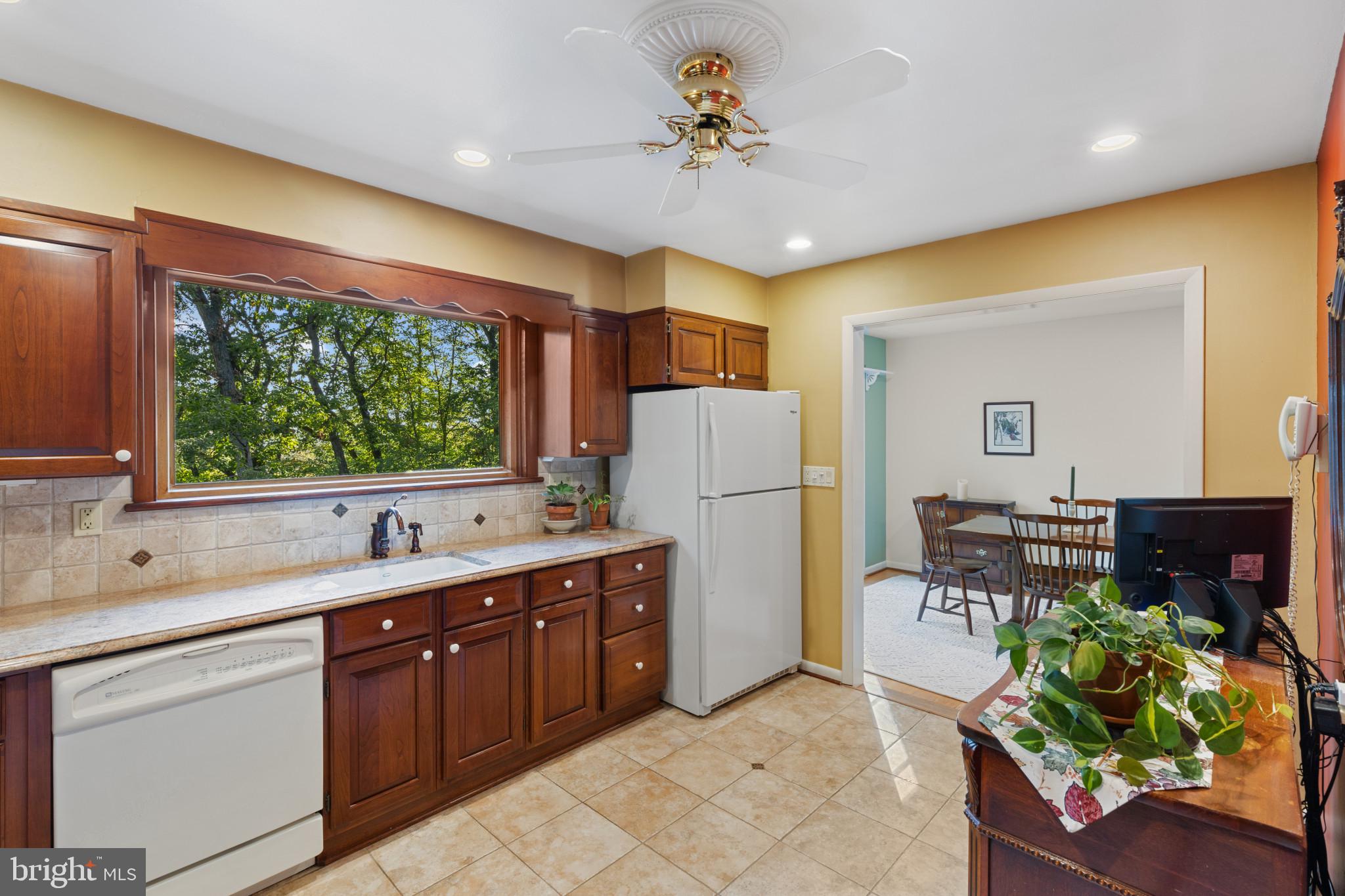 Well-designed kitchen with Cherry Wood Cabinetry